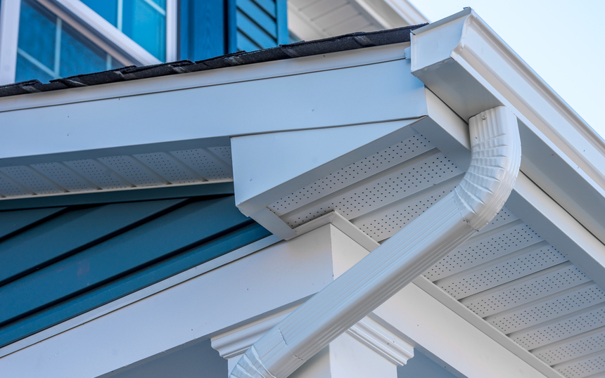 Seamless aluminium gutter and downpipe installed on a corrugated roof